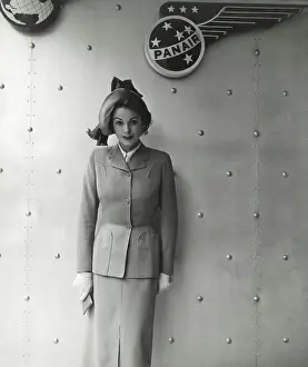 Signage: Model wearing a very smart two-piece travelling suit
