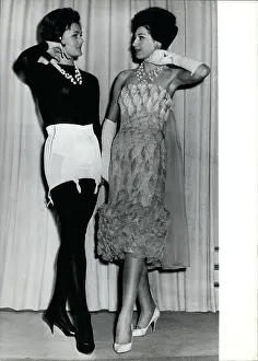 Suspender: Two models, one with corset on display