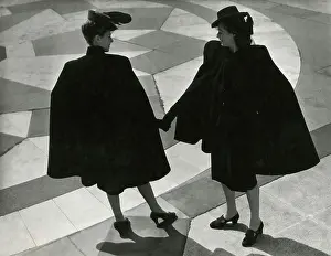 Two models in dark capes at Albert Memorial
