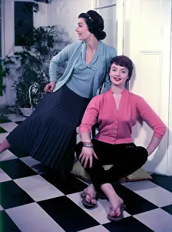 Knitwear: Two models in pastel tone knitwear