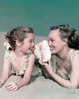 Conch: Mom And Daughter On Beach With Conch