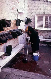 Wellies: Monastic life - nun mopping yard