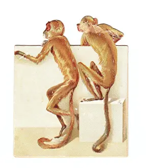 Entwined: Two monkeys on a cutout New Year card