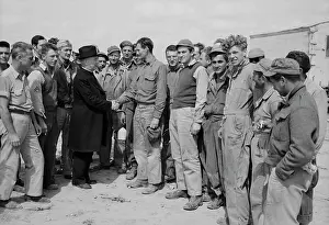 Monsignor: Monsignor Spellman shaking hands with Corporal