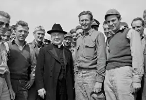 Monsignor: Monsignor Spellman shaking hands with Corporal