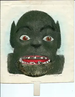 Monster's face with tab pull on a greetings card