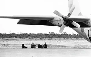 C130: Moroccan officers relax under the wings of their