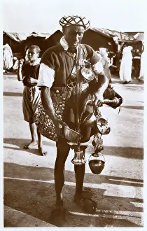 Gourd: Moroccan water carrier with containers and bell