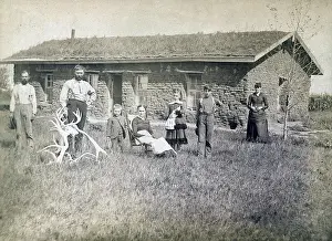 Morrison family in front of sod house