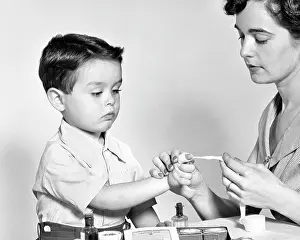 Administering: Mother Administering First Aid Using Gauze Bandage