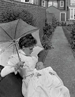 The Japics Historic Image Collection: Mother and baby in a garden