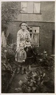 Lupins: Mother and her two boys in the garden