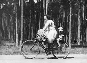 Hobby: Mother with child on bicycle, 1932