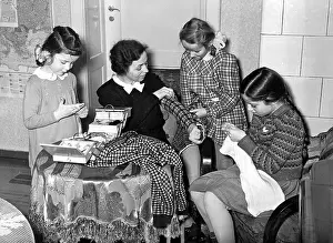 Poorly: Mother with her daughters doing handwork, 1941