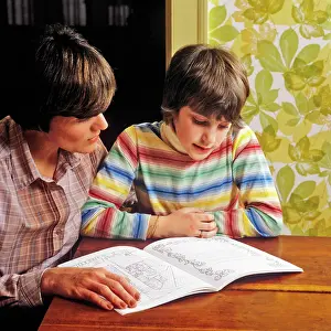Moms: Mother Helping her Daughter with Reading