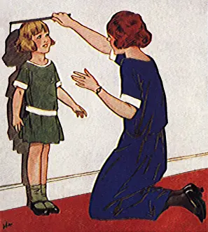 Mother Measuring Girl's Height