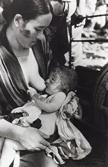 Yosuke: Mother nursing her baby after surviving of the