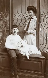 Eskimo: Mother and son with an American Eskimo