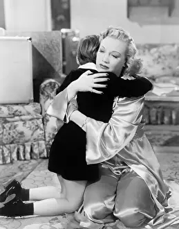 Saddened: Mother and son holding each other