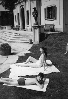 Towels: Mother and son sunbathing, Italy