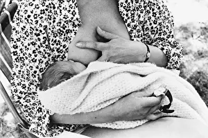 Suckles: Mother suckling baby