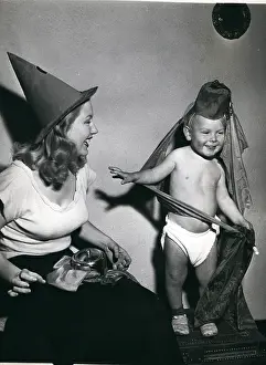 Tuition: Mother teaches toddler son magic tricks