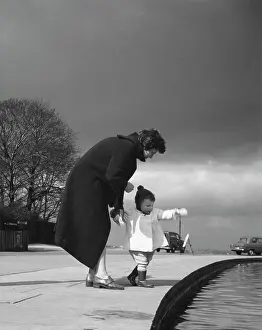 Whitestone: Mother and toddler looking at a pond