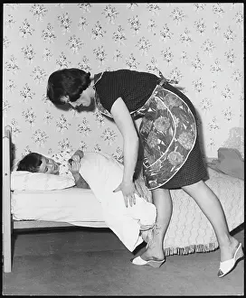 Bedtime: MOTHER TUCKING SON IN