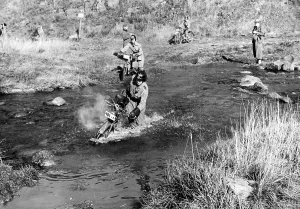 Motorcycles: Motor HJ members crossing a river, 1940