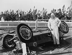 Wrecks: Motor racing accident - driver with overturned car