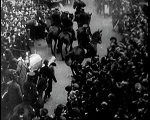Motorcade: A Motorcade Passing Through A Large Crowd In