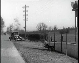 Forecourt: A Motorcar Driving Into the Forecourt Of the