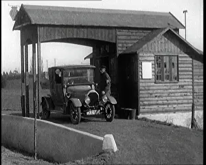 Forecourt: A Motorcar Driving Into the Forecourt Of the