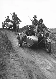 Belong: Motorcycle rifleman during a training ride, 1935
