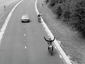Carriageway: Two motorcyclists overtaking a car