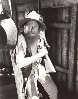 Hillbilly: Mountain man with rifle