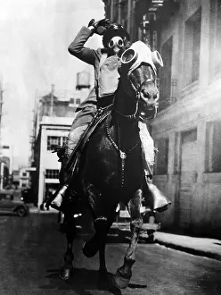 Greaves: Mounted policeman with accouterment for use of teargas i
