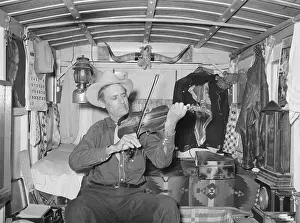 Weslaco: Mr. Bias playing the fiddle in his trailer home