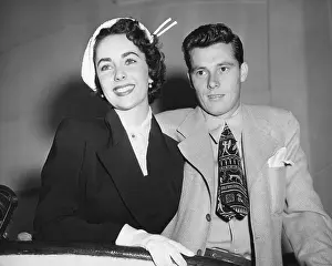 Heirs: Mr. and Mrs. Conrad Hilton sailing on the Queen