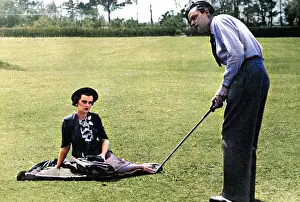 Putt: Mrs Charles Sweeny watching her husband play golf