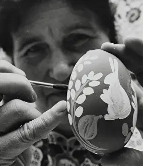 Gergely: Mrs. Gergely Tuth paints an Easter goose-egg. Hungary. M