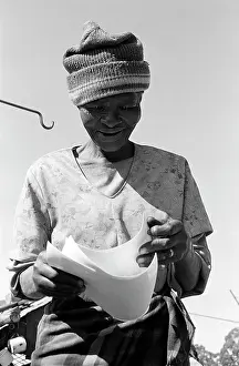 Molefe: Mrs Molefe looks at photographs of herself. Mr and