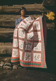 Stagg: Mrs. Bill Stagg displays her state quilt ?