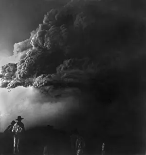 Natural Disaster: Mt. Pelee, on Martinique, obscured by clouds of