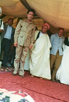Kneels: Muammar Gaddafi and Men praying - Sousa, Libya