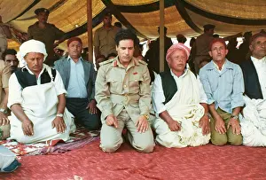 Kneels: Muammar Gaddafi and Men praying - Sousa, Libya