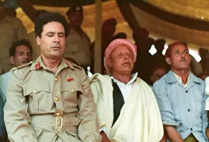 Kneels: Muammar Gaddafi and Men praying - Sousa, Libya