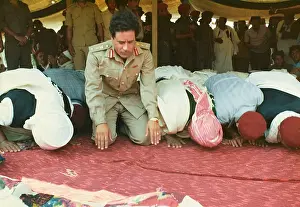Kneels: Muammar Gaddafi and Men praying - Sousa, Libya
