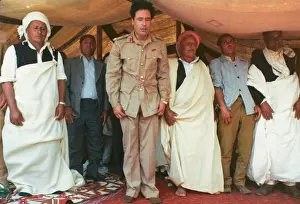 Kneels: Muammar Gaddafi and Men praying - Sousa, Libya