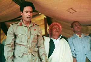 Kneels: Muammar Gaddafi and Men praying - Sousa, Libya